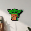 Unlit Grogu The Child LED lightbox mounted on a wall in daylight