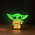 Front view of Grogu The Child LED lightbox sign glowing on a wooden desk