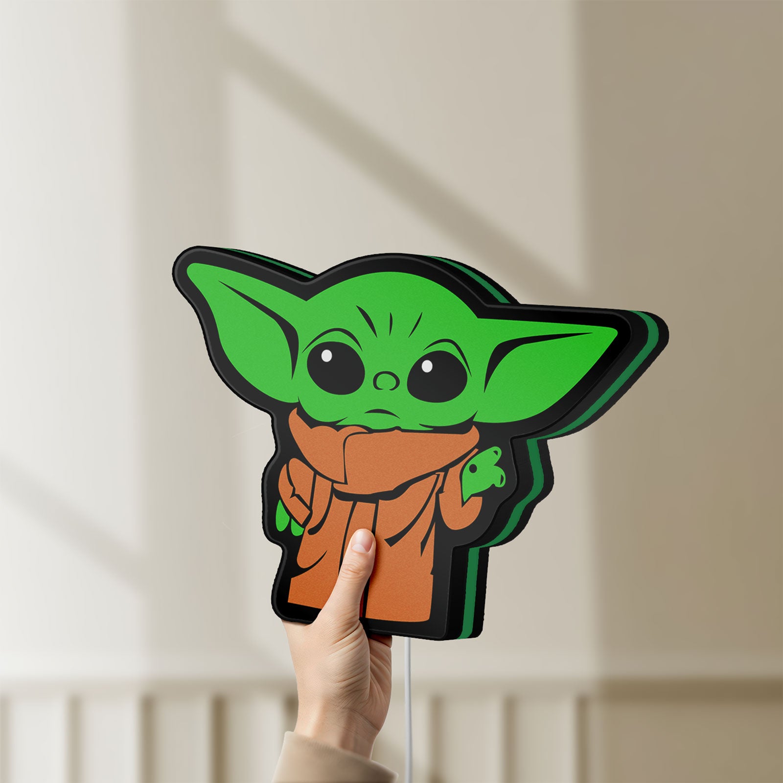 Unlit Grogu The Child LED lightbox held by hand to show size and details
