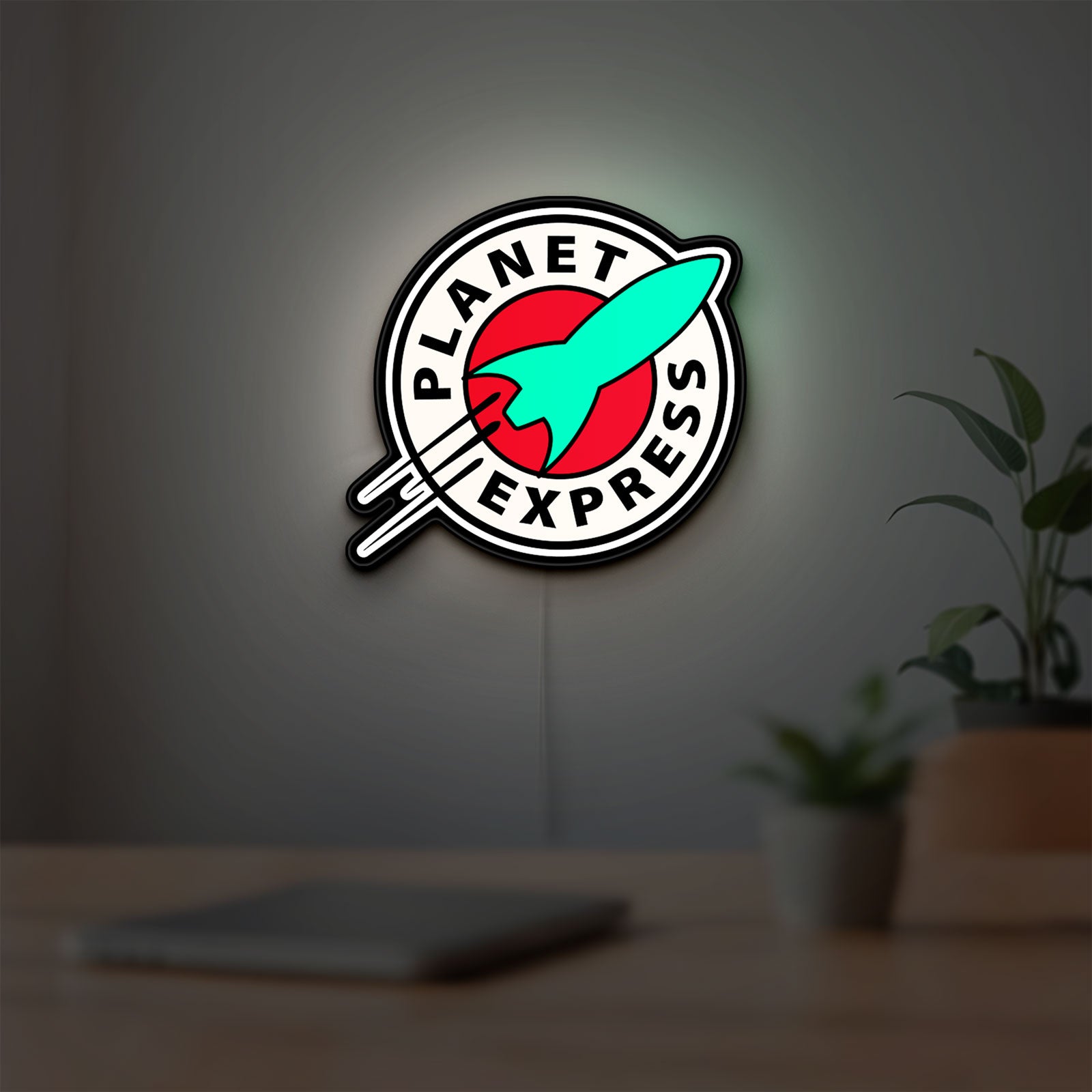 Planet Express LED lightbox hanging on a room wall with soft white light