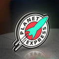 Planet Express LED lightbox standing on a desk from an angled side view with white glow