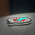 Planet Express LED lightbox lying flat on a desk with white glow