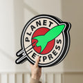 Unlit Planet Express LED lightbox held by hand to show size and details
