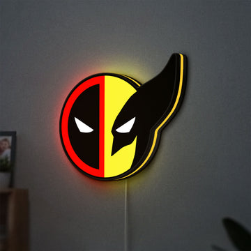Deadpool & Wolverine Icon LED lightbox hanging on a wall with yellow glow