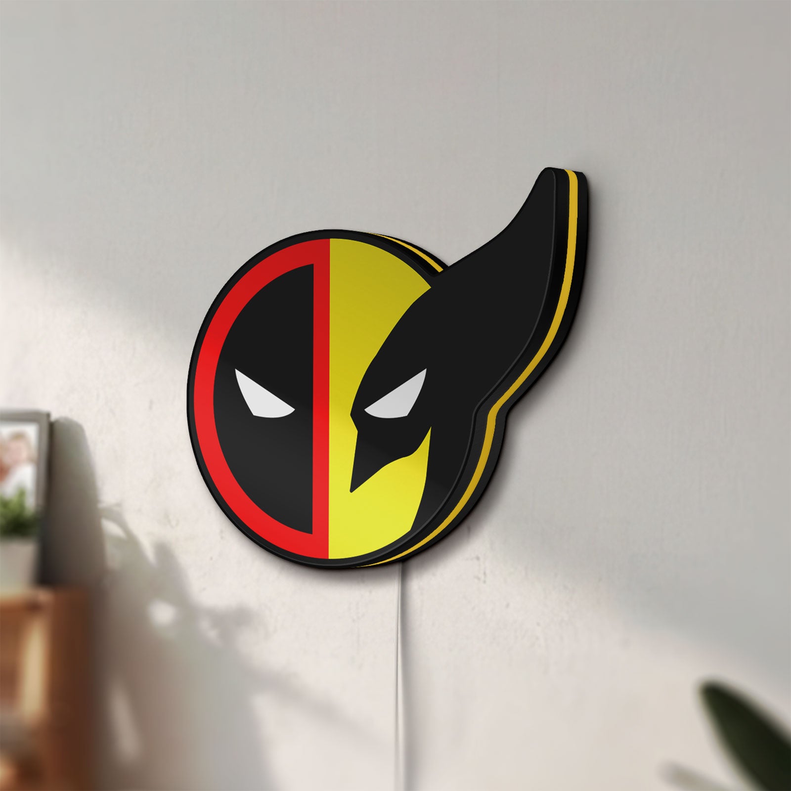 Unlit Deadpool & Wolverine Icon LED lightbox mounted on a wall in daylight