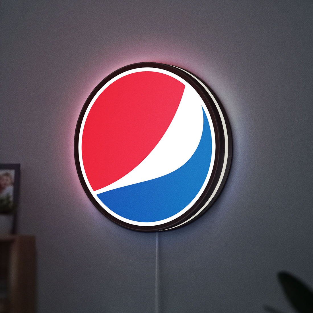 Pepsi LED lightbox hanging on a wall with white glow