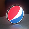 Pepsi LED lightbox standing on a desk from an angled side view with white glow