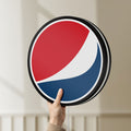 Unlit Pepsi LED lightbox held by hand to show size and details