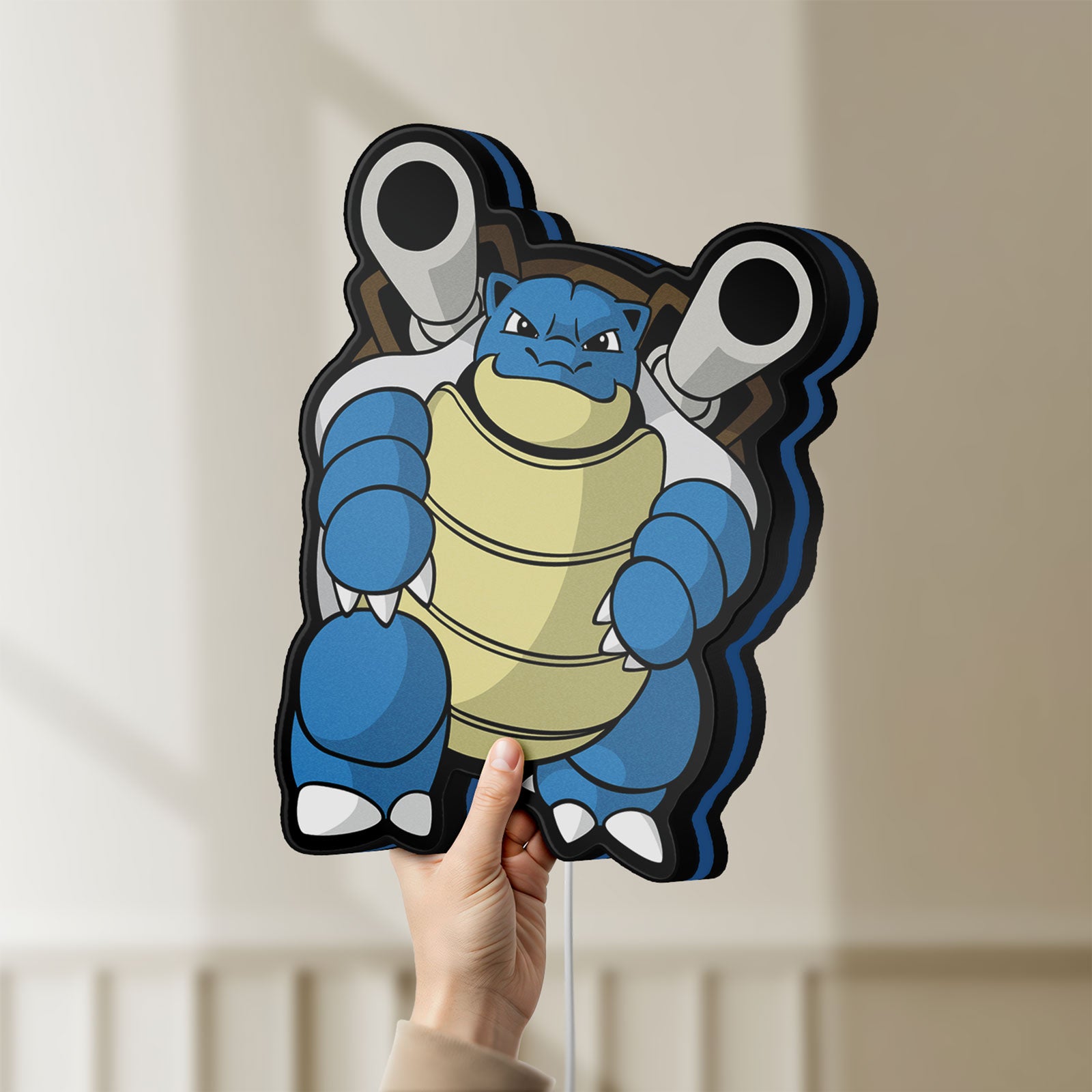 Unlit Blastoise LED lightbox held by hand to show size and details