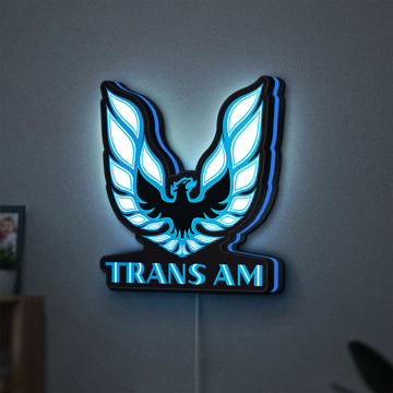 Trans Am LED lightbox hanging on a wall with blue glow