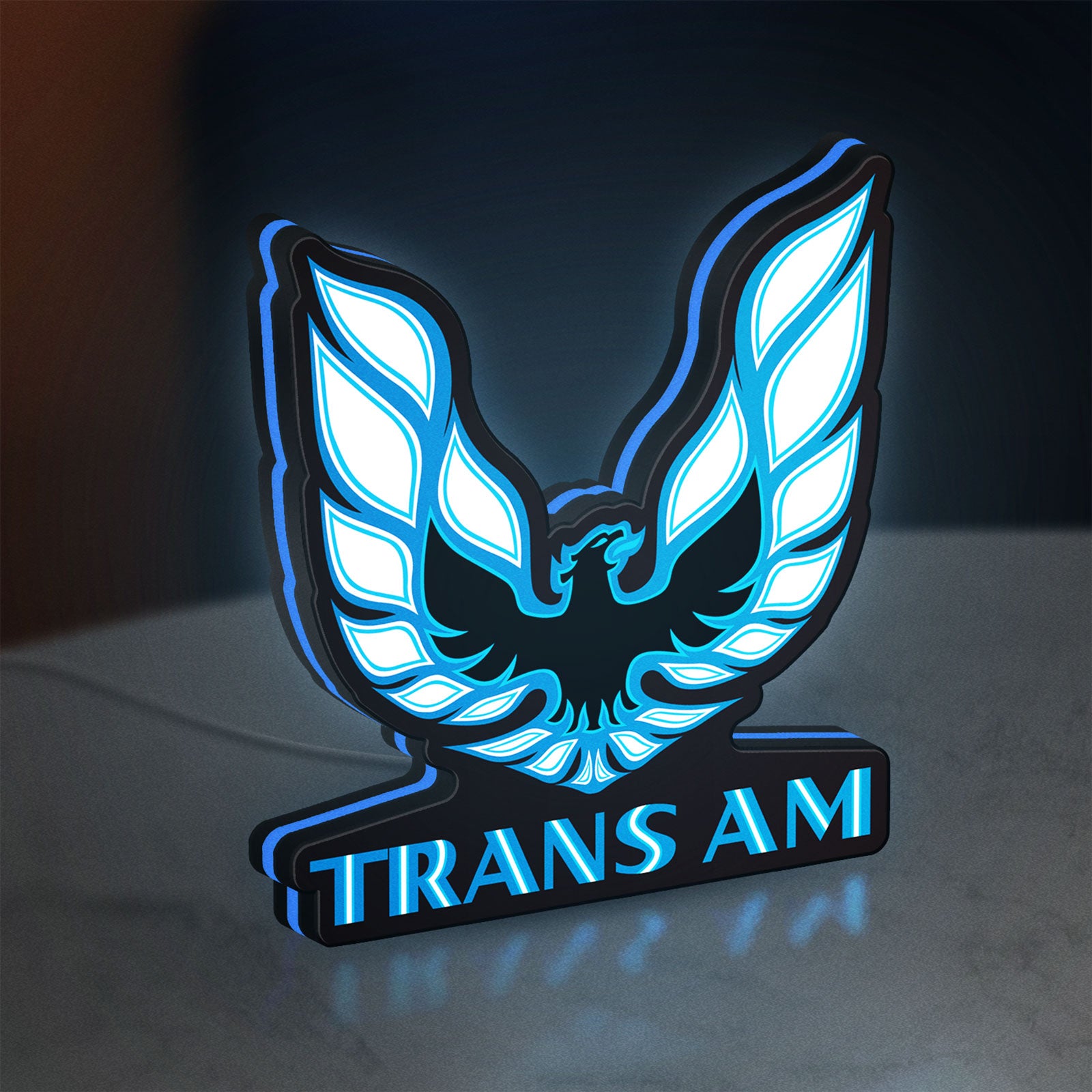 Trans Am LED lightbox standing on a desk from an angled side view with blue glow