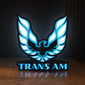 Front view of Trans Am LED lightbox sign glowing on a wooden desk