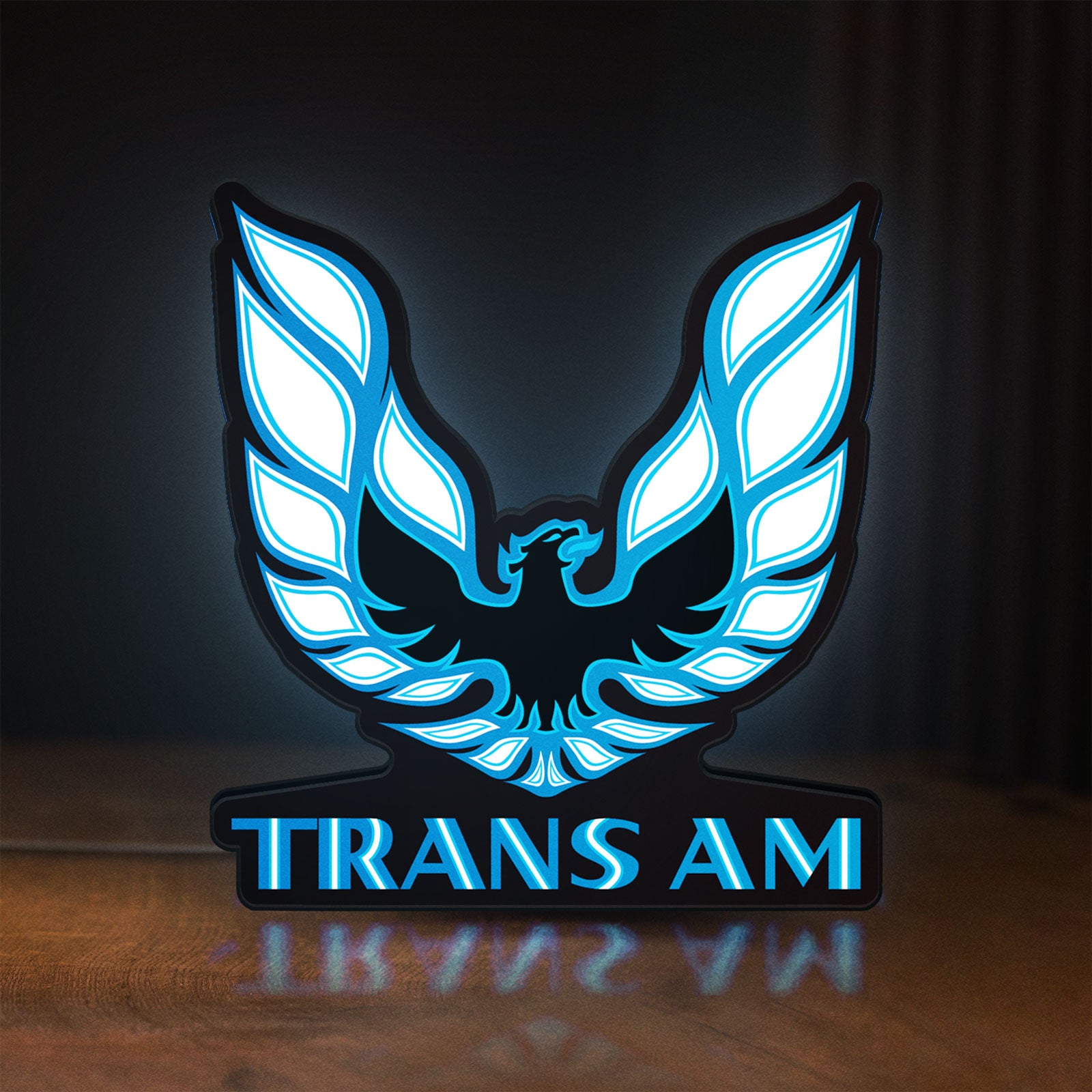 Front view of Trans Am LED lightbox sign glowing on a wooden desk