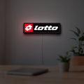 Lotto LED lightbox hanging on a room wall with soft red light