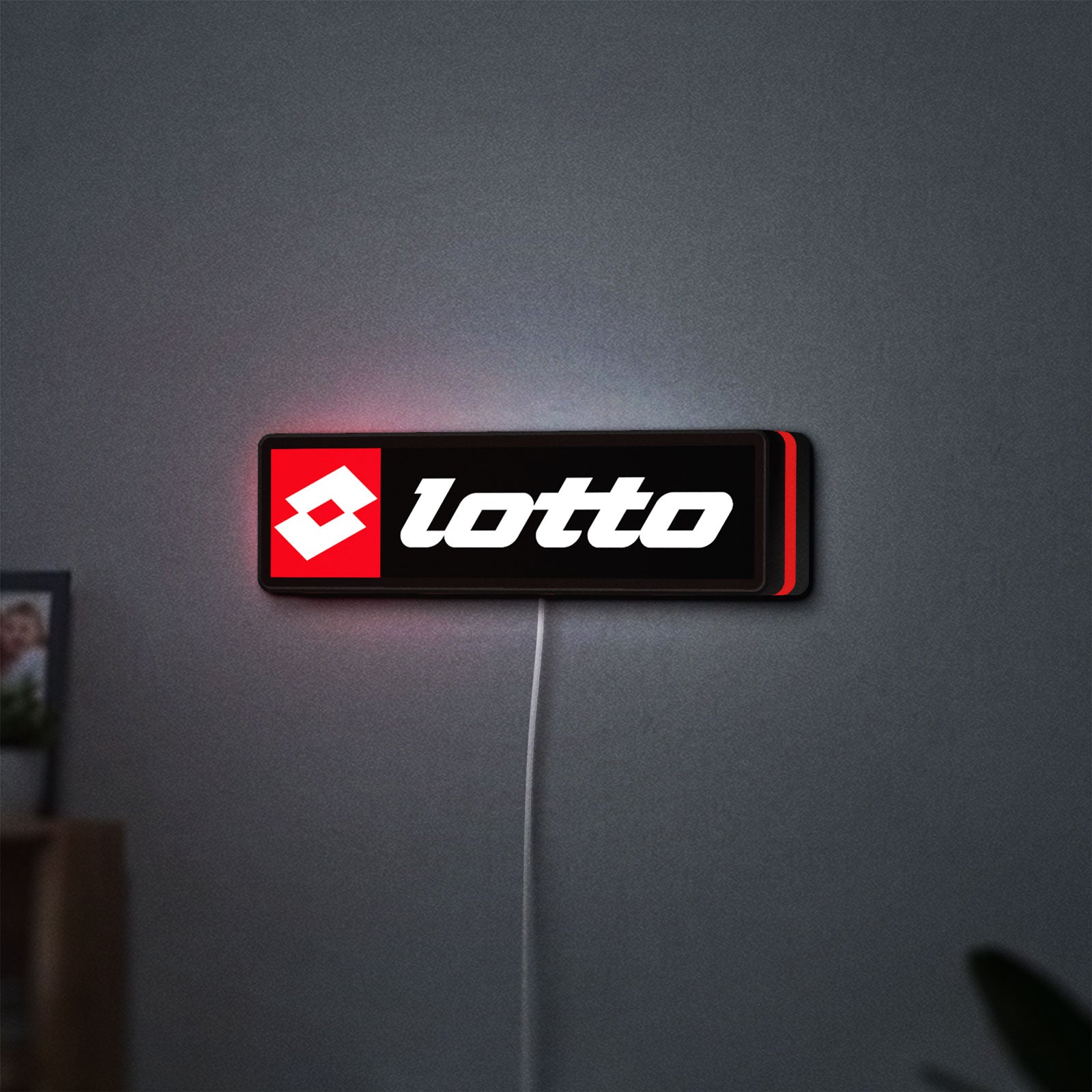 Lotto LED lightbox hanging on a wall with red glow