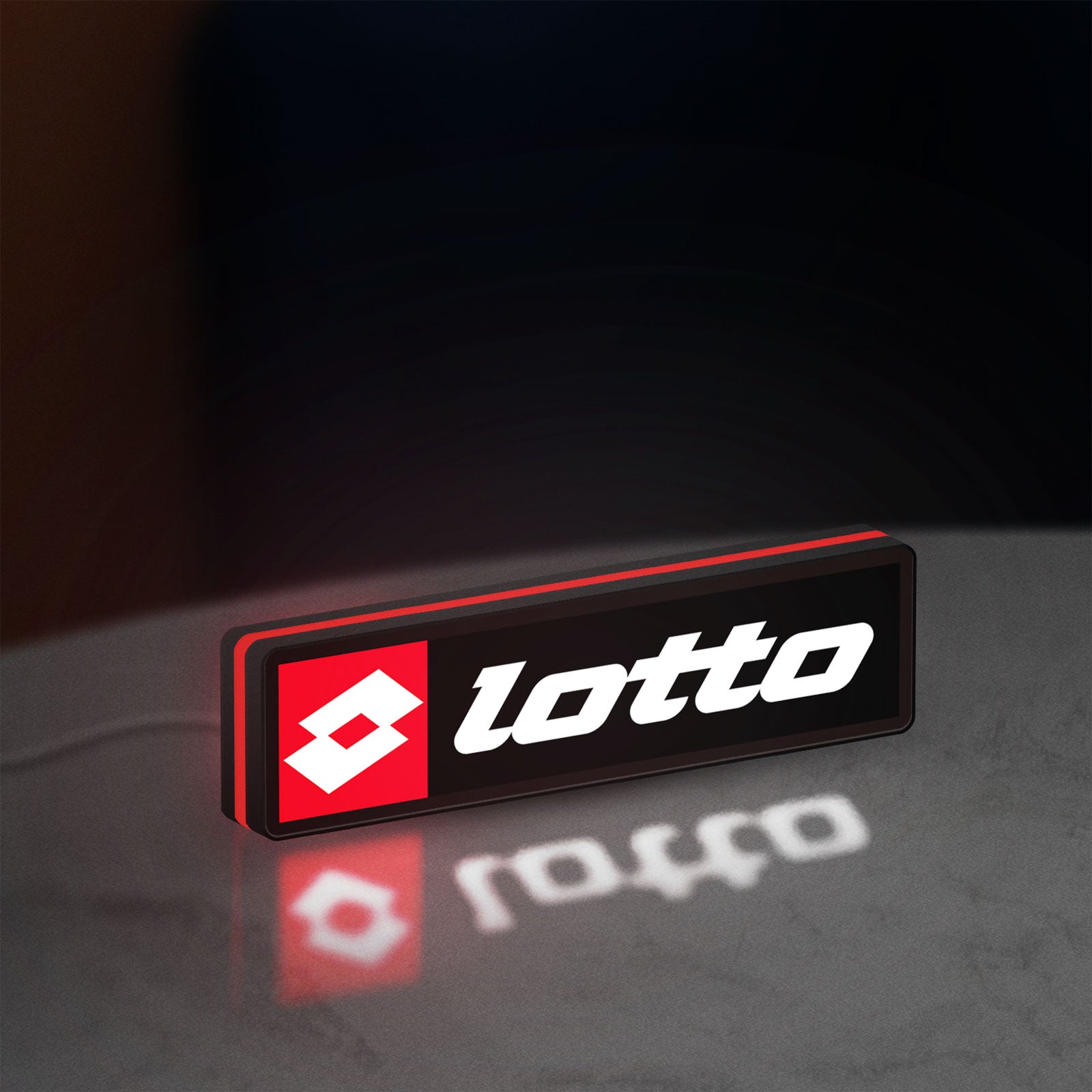 Lotto LED lightbox standing on a desk from an angled side view with red glow
