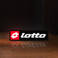 Front view of Lotto LED lightbox sign glowing on a wooden desk