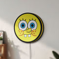 Unlit Sponge Bob LED lightbox mounted on a wall in daylight