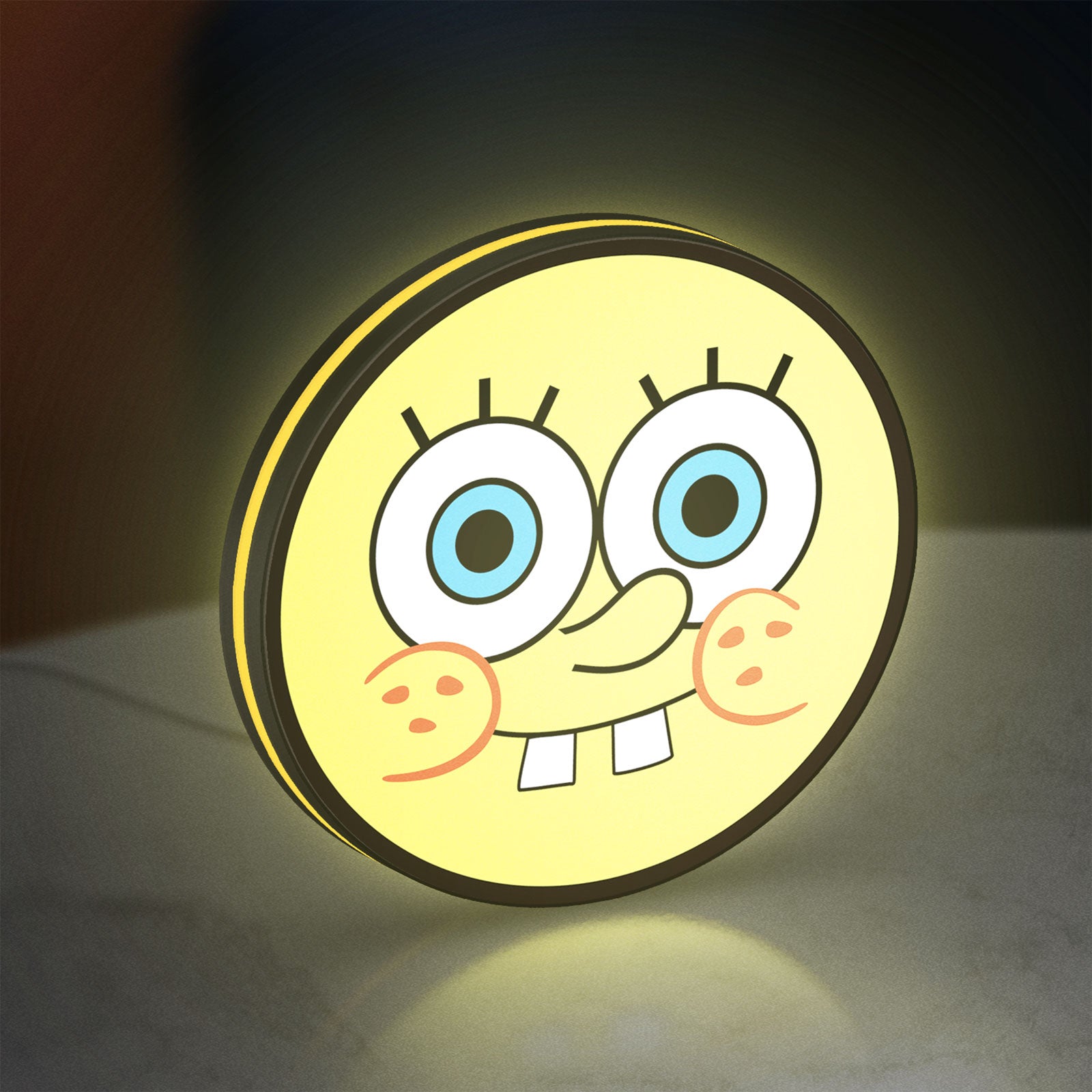 Sponge Bob LED lightbox standing on a desk from an angled side view with yellow glow