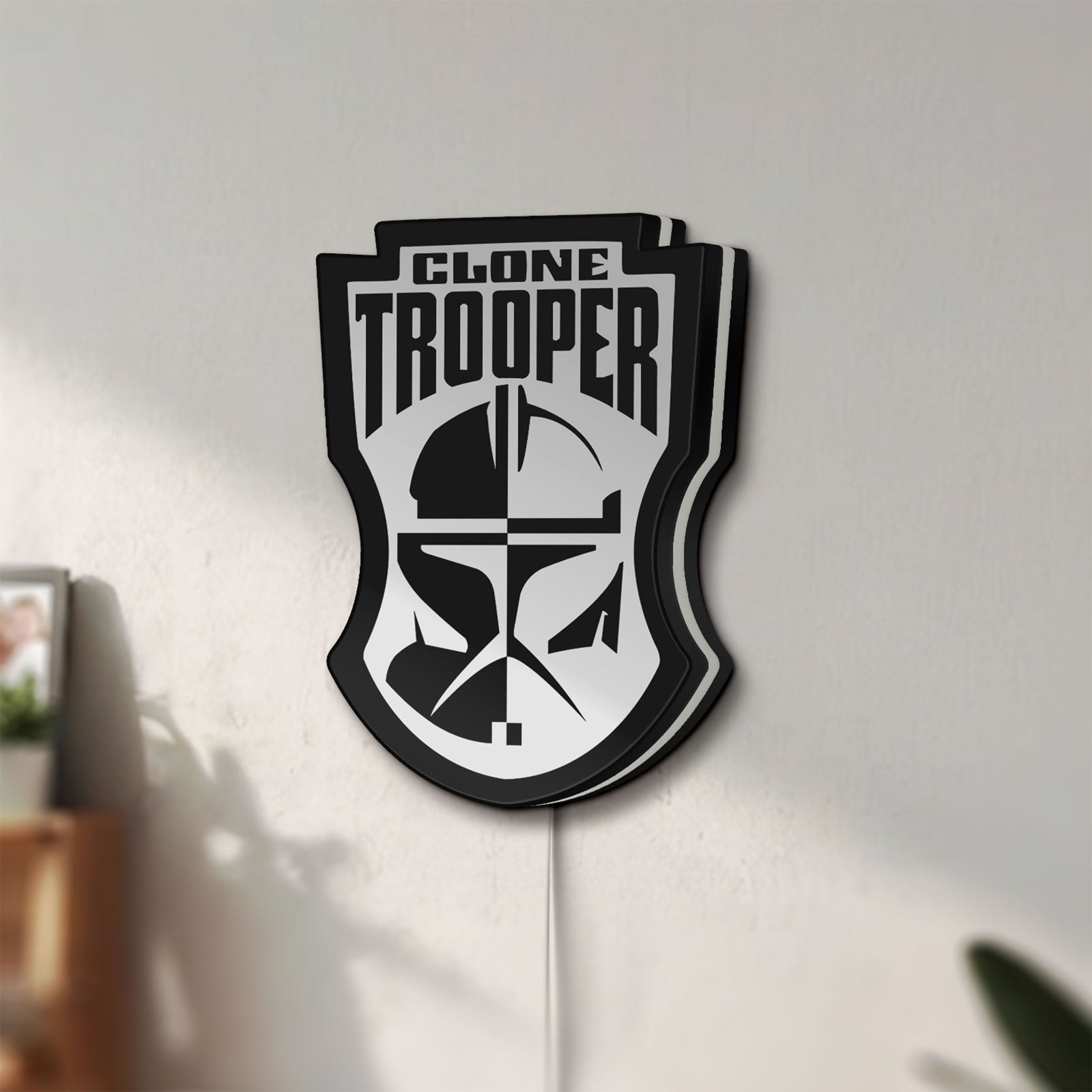 Unlit Clone Trooper LED lightbox mounted on a wall in daylight