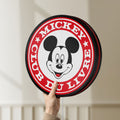 Unlit Mickey Club Du Livre LED lightbox held by hand to show size and details
