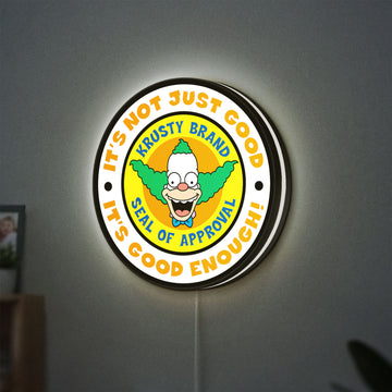The Simpsons LED lightbox hanging on a wall with white glow