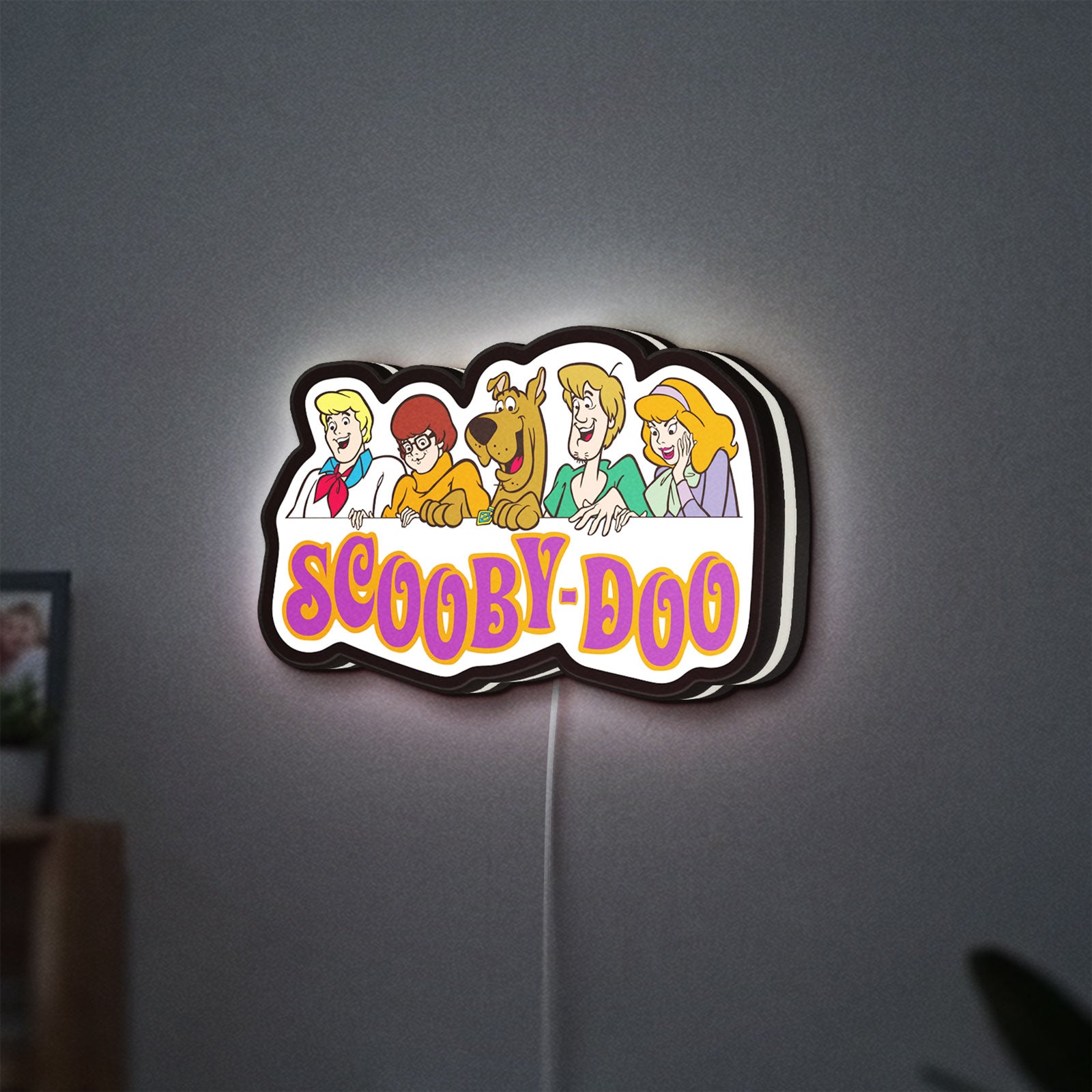 Scooby Doo LED lightbox hanging on a wall with white glow