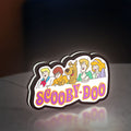 Scooby Doo LED lightbox standing on a desk from an angled side view with white glow