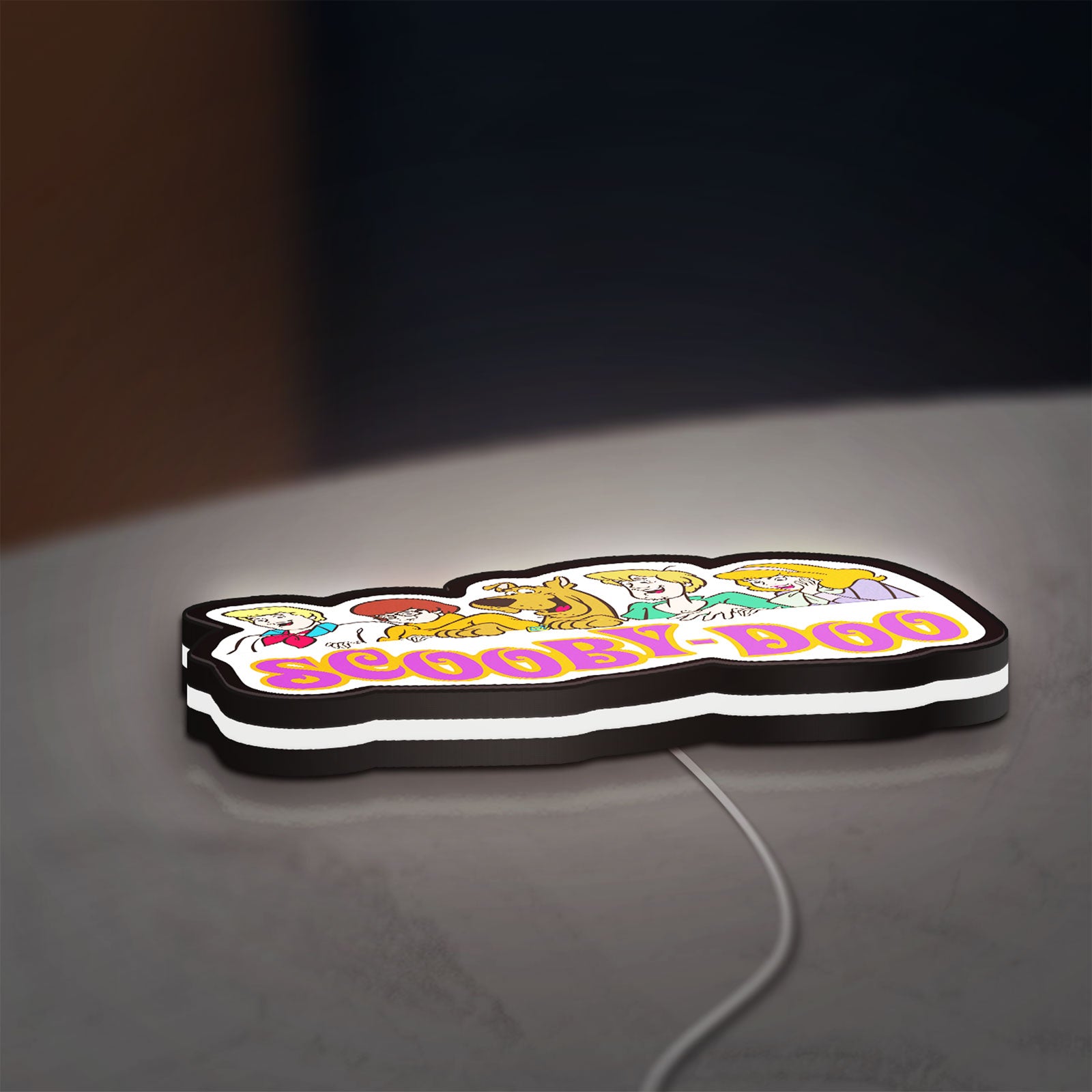 Scooby Doo LED lightbox lying flat on a desk with white glow
