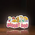 Front view of Scooby Doo LED lightbox sign glowing on a wooden desk