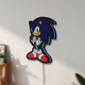 Unlit Sonic Hedgehog LED lightbox mounted on a wall in daylight