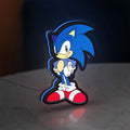 Sonic Hedgehog LED lightbox standing on a desk from an angled side view with blue glow