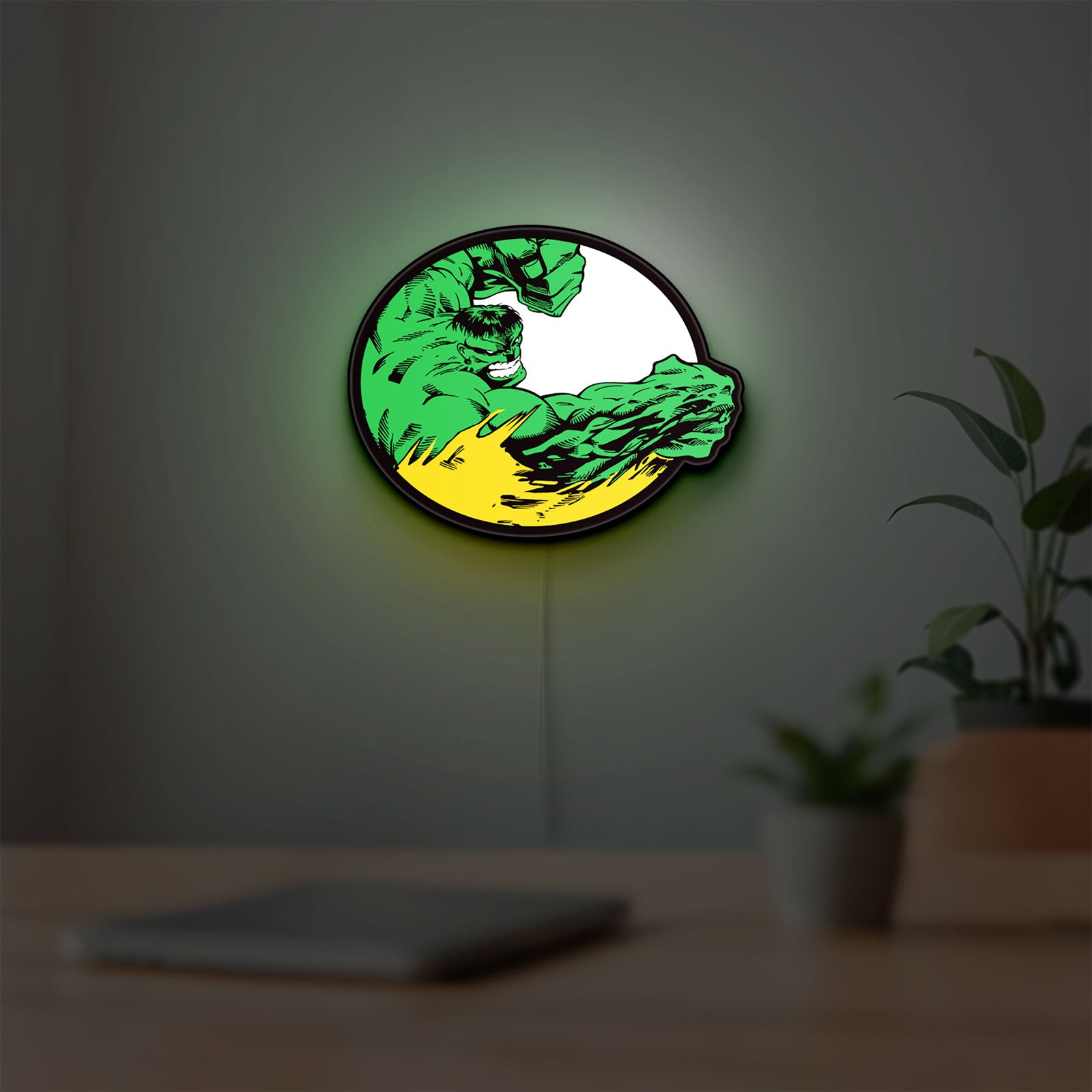 Hulk LED lightbox hanging on a room wall with soft green light