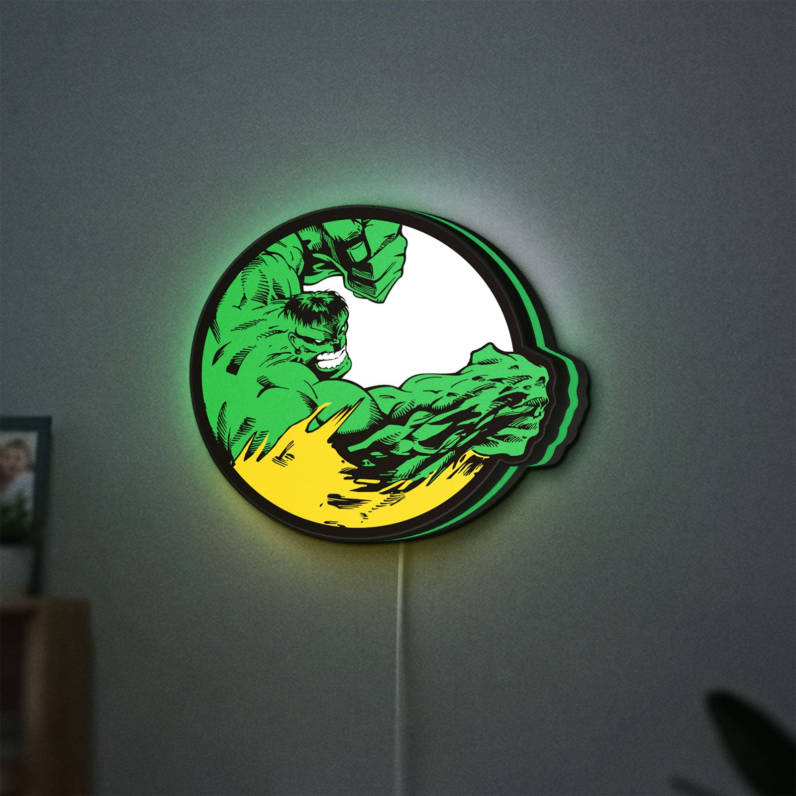 Hulk LED lightbox hanging on a wall with green glow