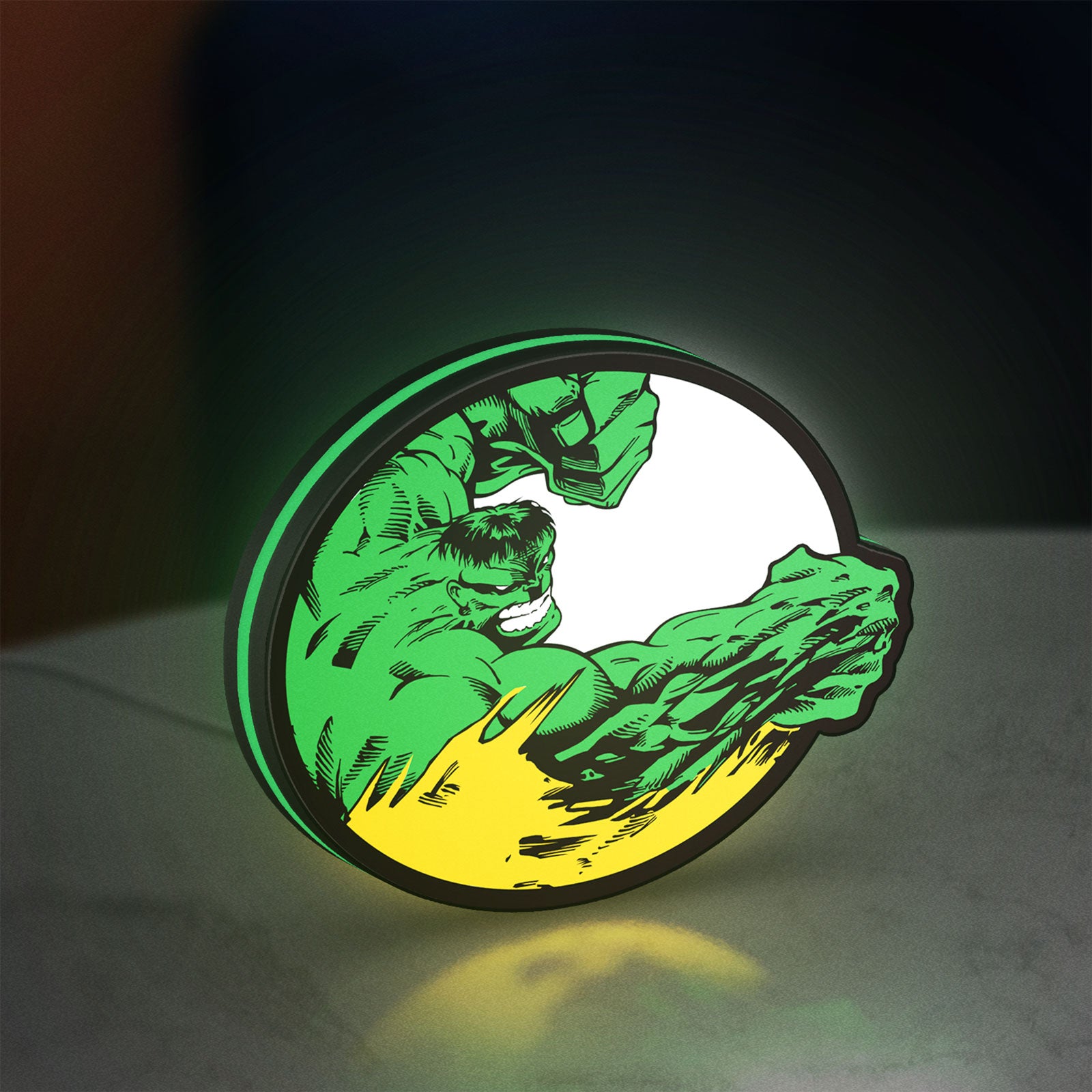 Hulk LED lightbox standing on a desk from an angled side view with green glow