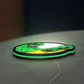 Hulk LED lightbox lying flat on a desk with green glow