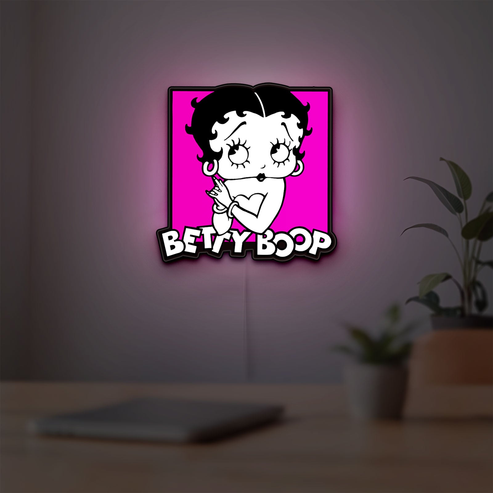 Betty Boop LED lightbox hanging on a room wall with soft pink light
