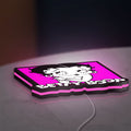 Betty Boop LED lightbox lying flat on a desk with pink glow