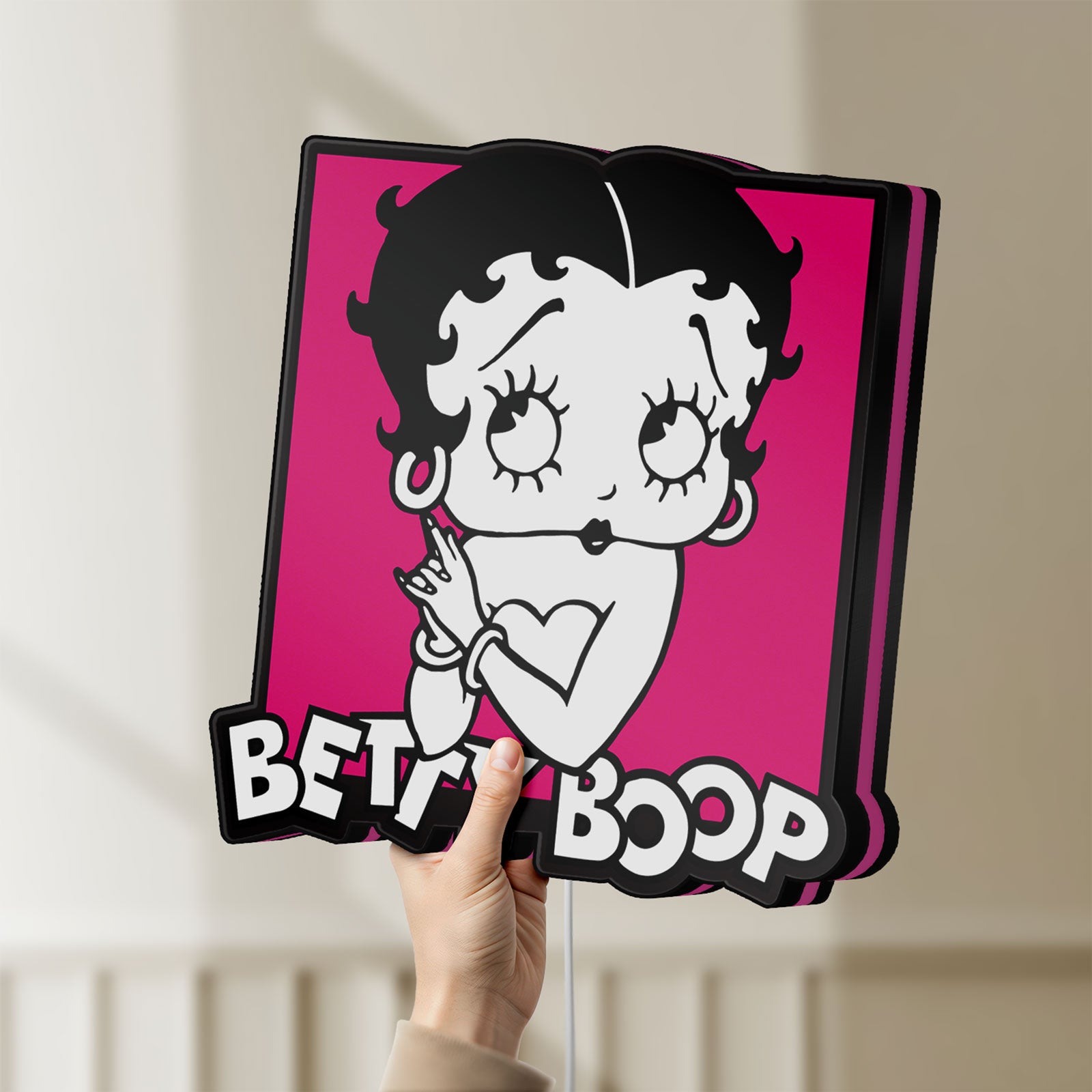 Unlit Betty Boop LED lightbox held by hand to show size and details