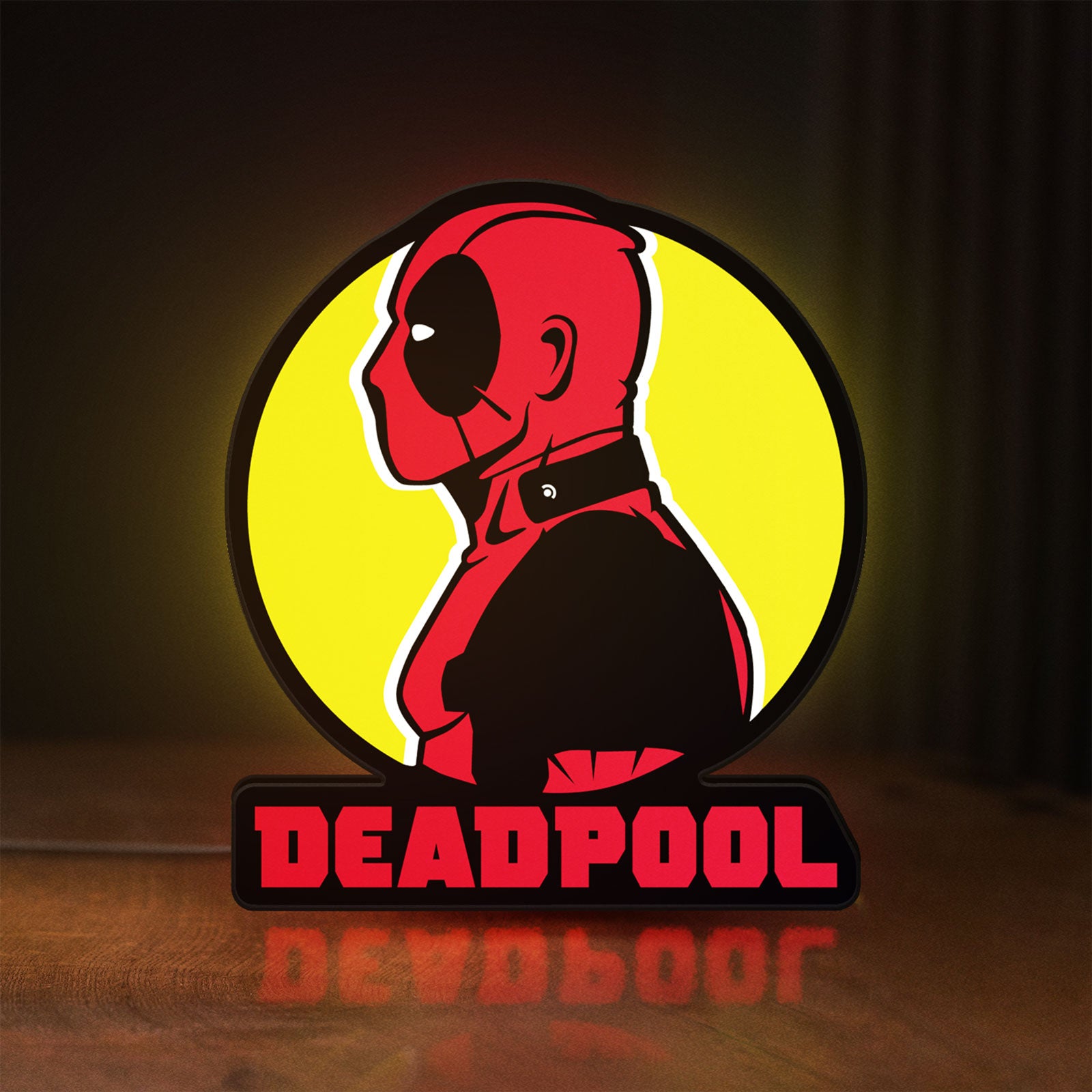 Front view of Deadpool LED lightbox sign glowing on a wooden desk