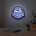 Tiburones De La Guaira LED lightbox hanging on a room wall with soft blue light