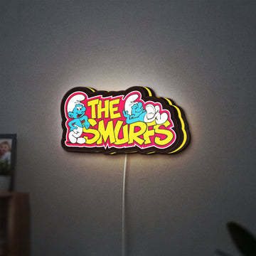 Smurfs LED lightbox hanging on a wall with yellow glow