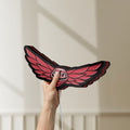 Unlit Troy Lee Designs LED lightbox held by hand to show size and details
