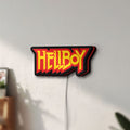 Unlit Hellboy LED lightbox mounted on a wall in daylight