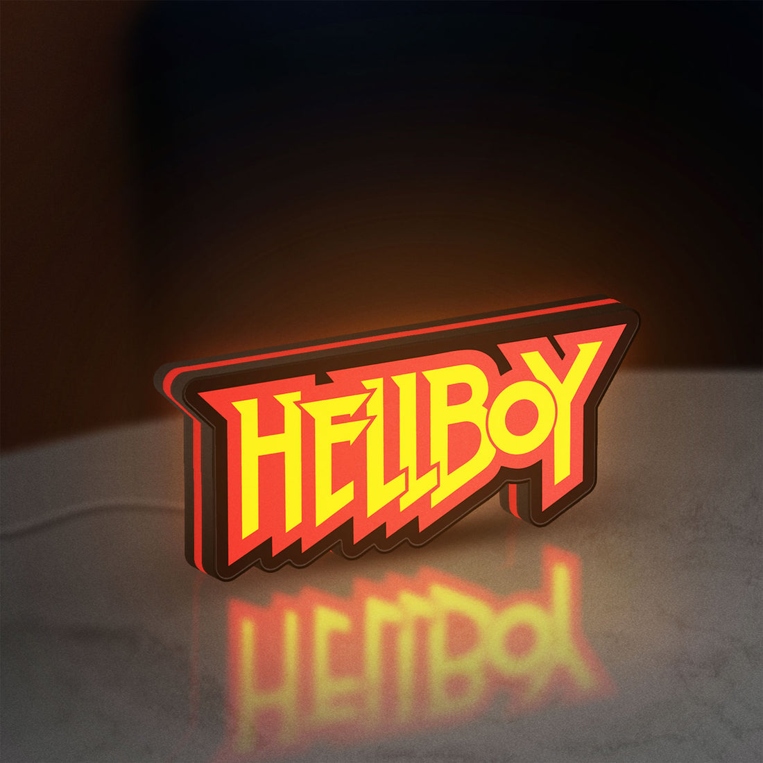 Hellboy LED lightbox hanging on a wall with red glow