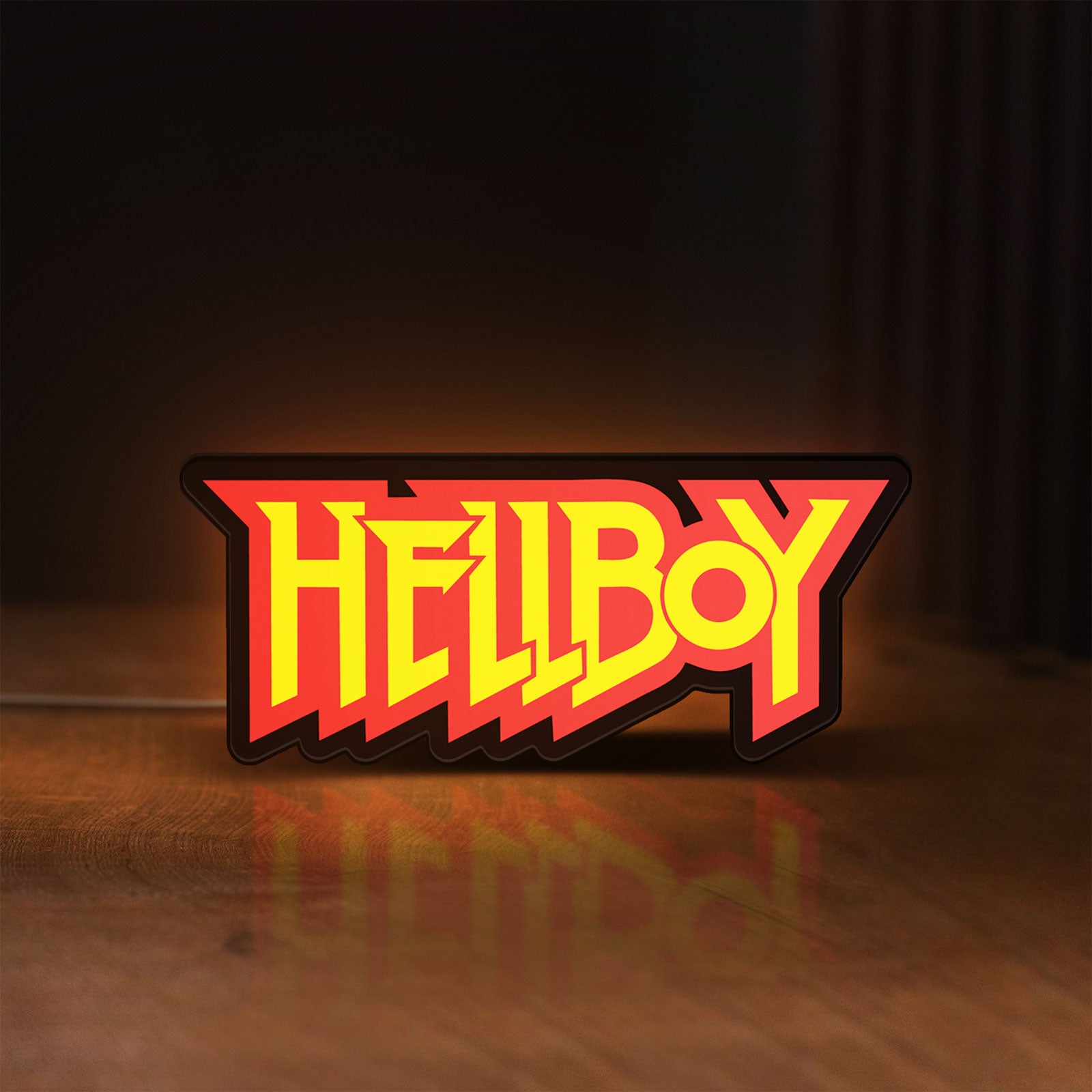 Front view of Hellboy LED lightbox sign glowing on a wooden desk