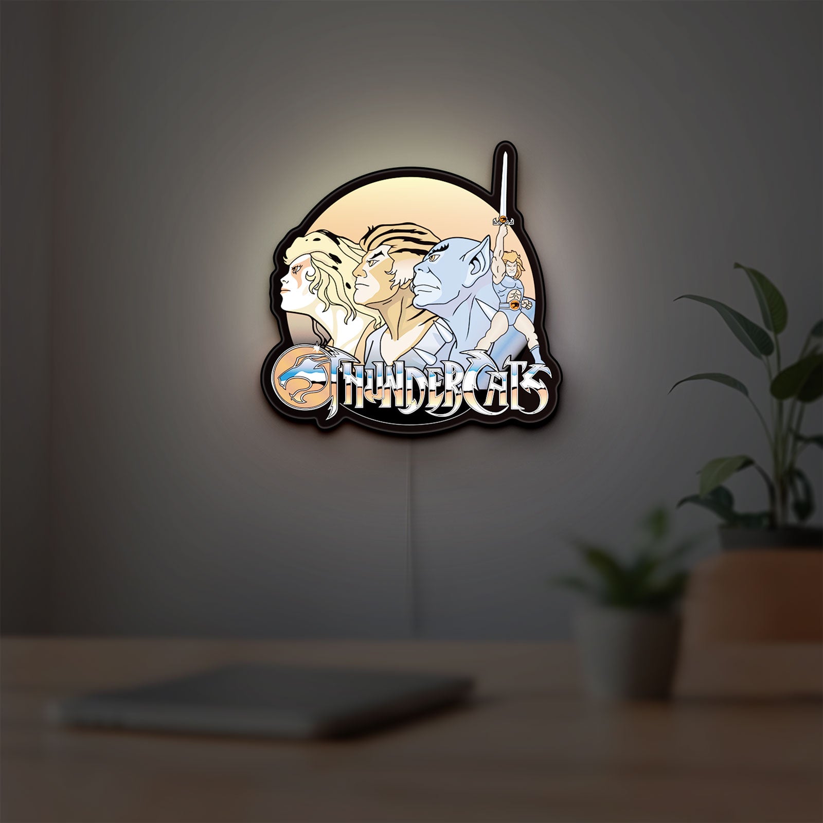 Thundercats LED lightbox hanging on a room wall with soft white light