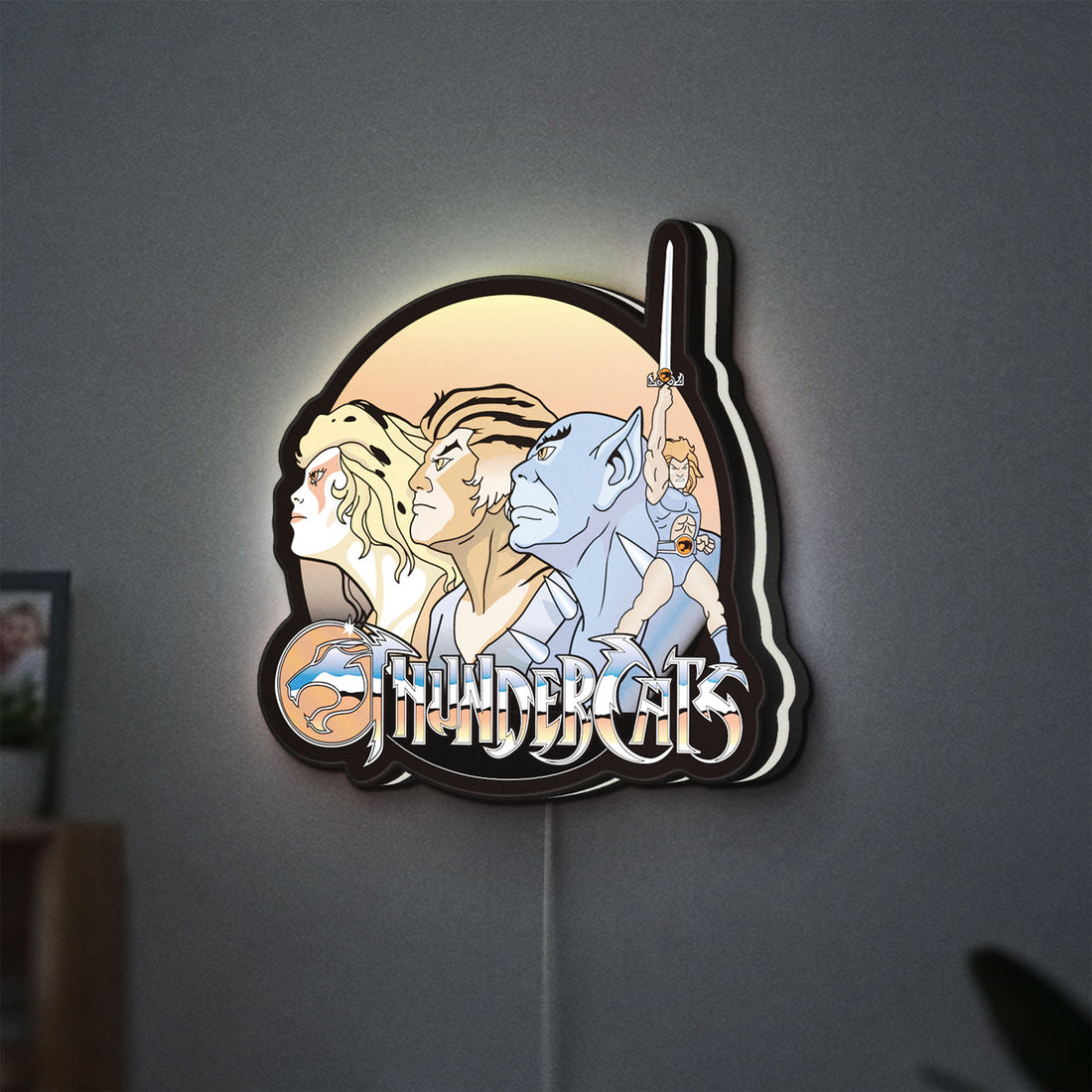 Thundercats LED lightbox hanging on a wall with white glow