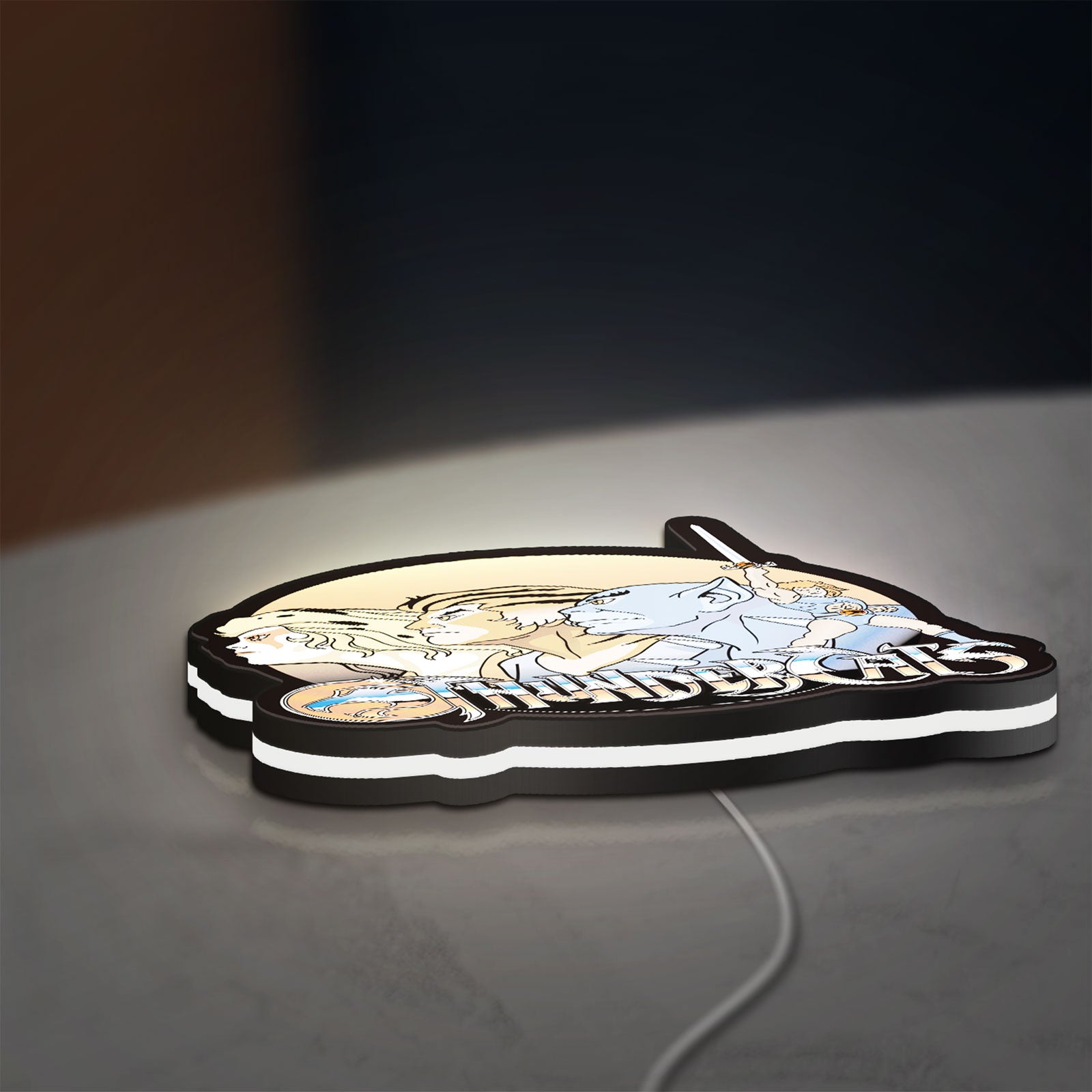 Thundercats LED lightbox lying flat on a desk with white glow