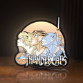 Front view of Thundercats LED lightbox sign glowing on a wooden desk